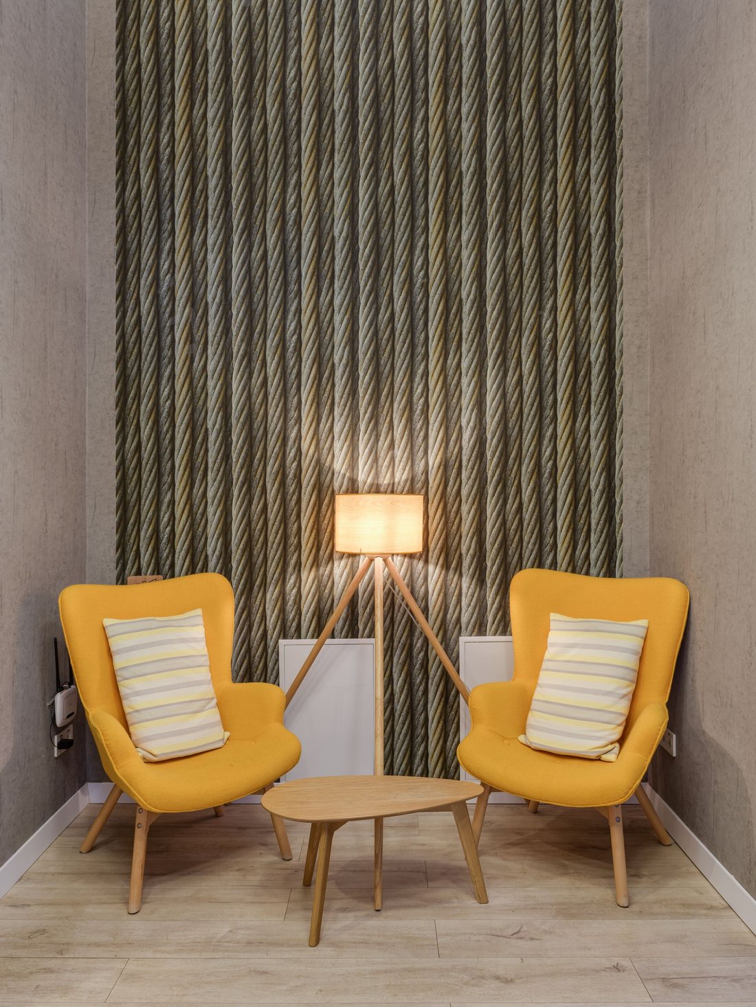 Sitting area with an olive-green striped wallcovering